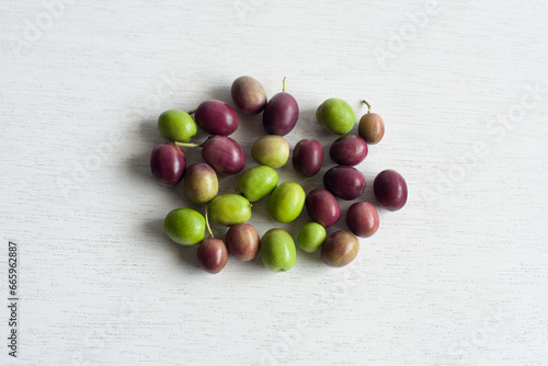Fresh Olives, Green and Purple Fruits, isolated on white background