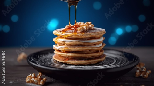 stack of pancakes with honey on top