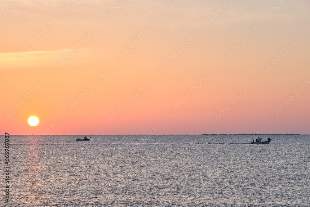 Dawn at sea when fishermen go out fishing Dawn at sea when fishermen go out fishing