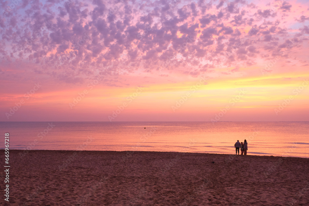 Sunrise with pink colors on the seashore