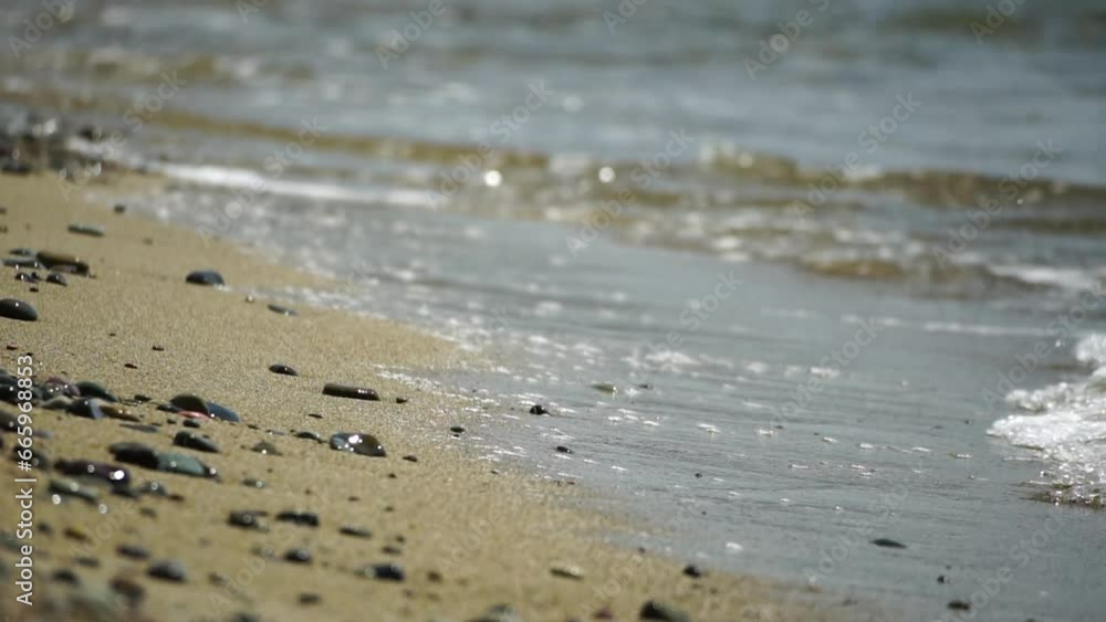 Small sea wave, Blurred Soft foamy waves washing golden sandy beach on sunset. Ocean Waves On Sandy Beach. Nobody. Holiday recreation concept. Abstract nautical summer ocean sunset nature background. Small sea wave, Blurred Soft foamy waves washing golden sandy beach on sunset. Ocean Waves On Sandy Beach. Nobody. Holiday recreation concept. Abstract nautical summer ocean sunset nature background.
