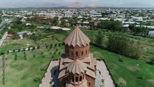 Ascending footage of Surp Hovhannes Church (St. John Church) on a sunny day in Artashat, Armenia photo
