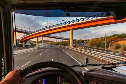 View from the driving position of a truck of a highway with several bridges at different levels, scalectric type crossing. photo