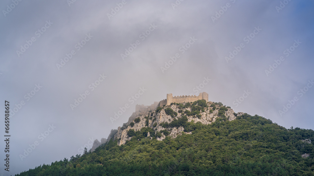 Scenic landscape panorama of ancient medieval Puilaurens cathar castle ruin on hill, Lapradelle-Puilaurens, Aude, France