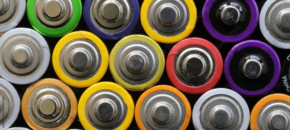 many round batteries and one red battery many round batteries and one red battery