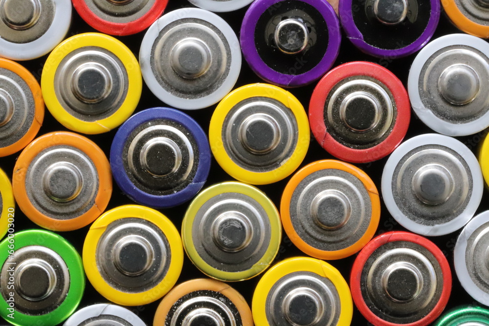 many round batteries and one red battery many round batteries and one red battery
