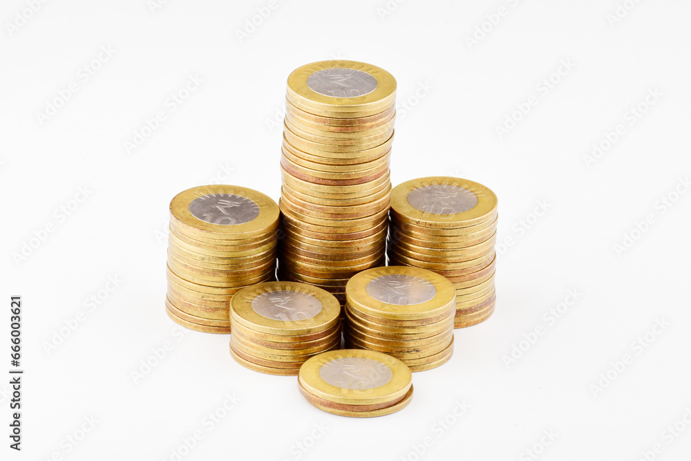 Ten rupees coin pile isolated on white background with clipping path Ten rupees coin pile isolated on white background with clipping path