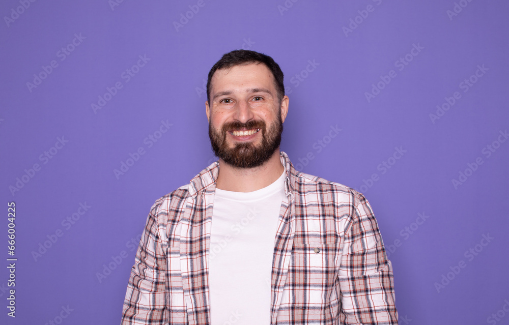 Young handsome bearded man over isolated purple background happy and smiling. Young handsome bearded man over isolated purple background happy and smiling.