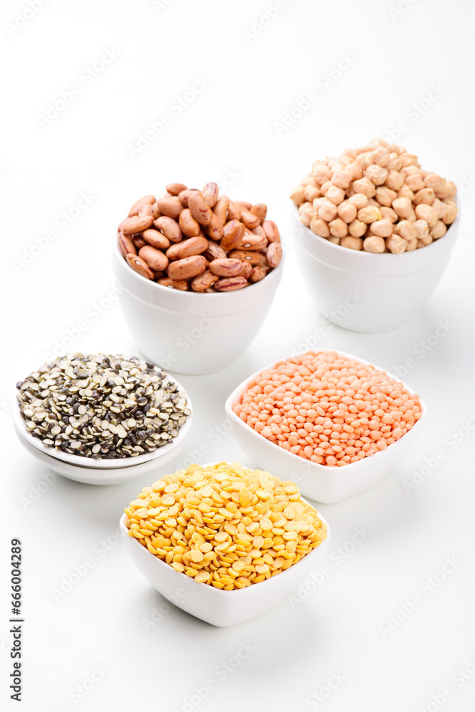 Assorted raw legume and beans in bowl isollated on white background Assorted raw legume and beans in bowl isollated on white background