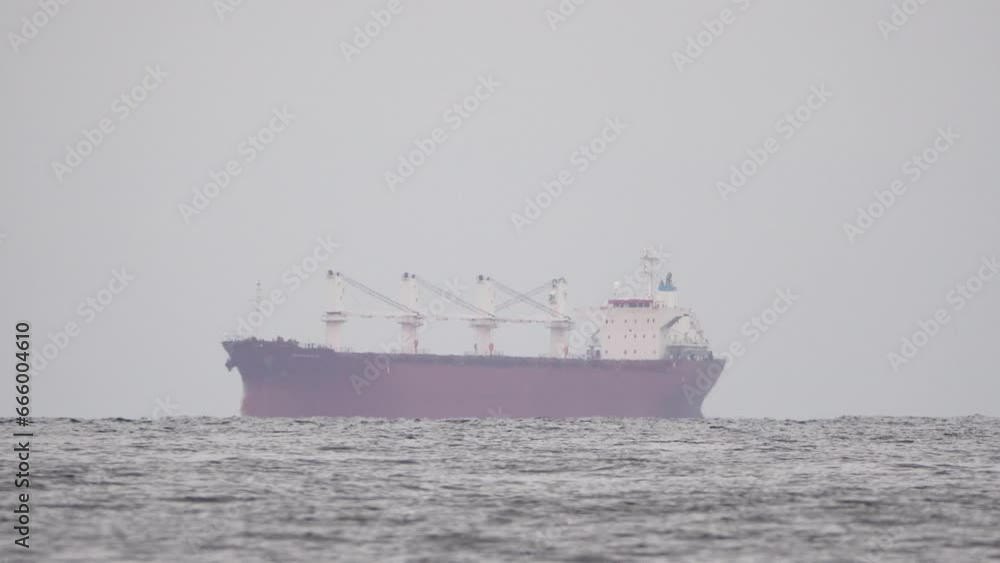 Cargo and dredging industrial ships sailing in to sea horizon. One large cargo ship grain carrier tanker in sea on sunny day. Transport, sea freight, sea transportation of cargo. Cargo and dredging industrial ships sailing in to sea horizon. One large cargo ship grain carrier tanker in sea on sunny day. Transport, sea freight, sea transportation of cargo.