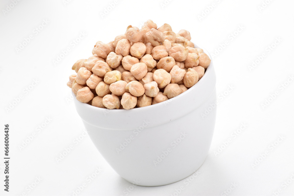 Uncooked chickpeas in bowl on white background Uncooked chickpeas in bowl on white background