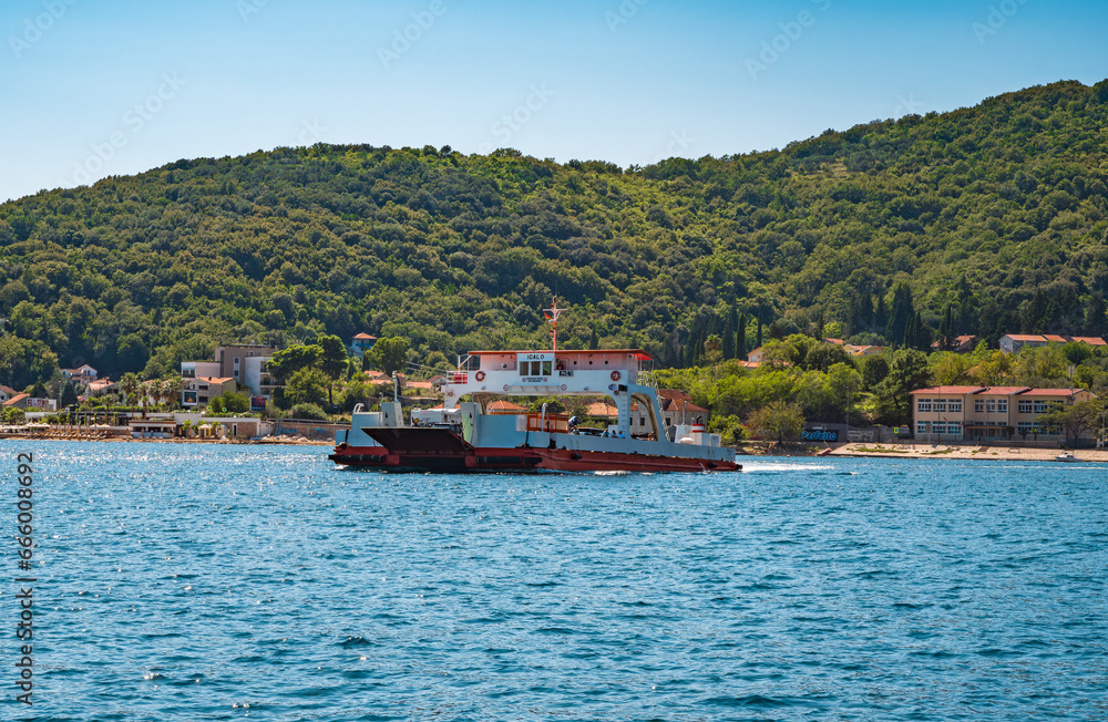 Tivat, Montenegro - September 6 2023: ferry with cars and tourists between Lepetane-Kamenari Tivat, Montenegro - September 6 2023: ferry with cars and tourists between Lepetane-Kamenari