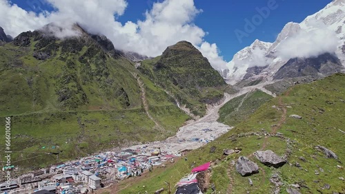 An aerial view of the Kedarnath Temple amidst the stunning Himalayan mountain range photo