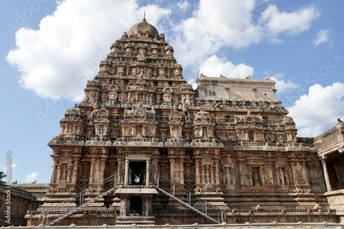 Ancient hindu temple tower. Airavatesvara Temple against blue sky background in Darasuram  Kumbakonam  Tamilnadu.