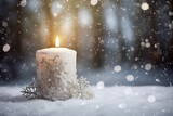 Advent candle on Christmas with snow