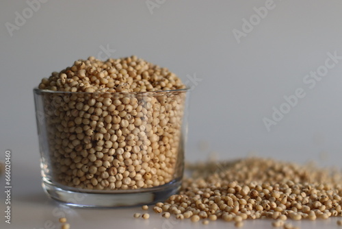Closeup of sorghum millet grains kept in a glass bowl filled to the brim