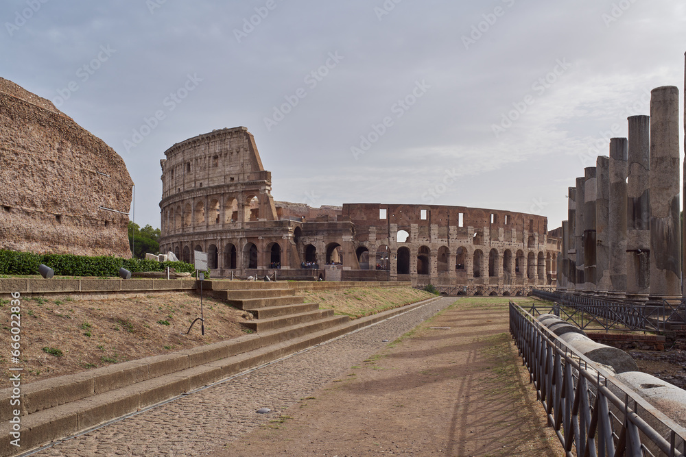Morning view of the Colosseum (Colosseo, Anfiteatro Flavio) from the Roman forum in Rome, Italy	