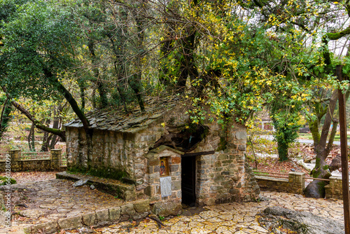 Obraz na płótnie The Church of Agia Theodora in Arcadia, Greece is characterized as a wonder of nature as on top of a small Byzantine church there are 17 oak trees. w salonie