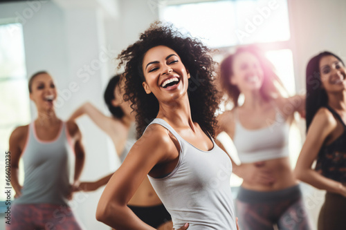 Dance class group of beautiful women dancing and enjoying workouts practicing choreography moves with an instructor in a fitness studio Modern lifestyle, happiness concept.