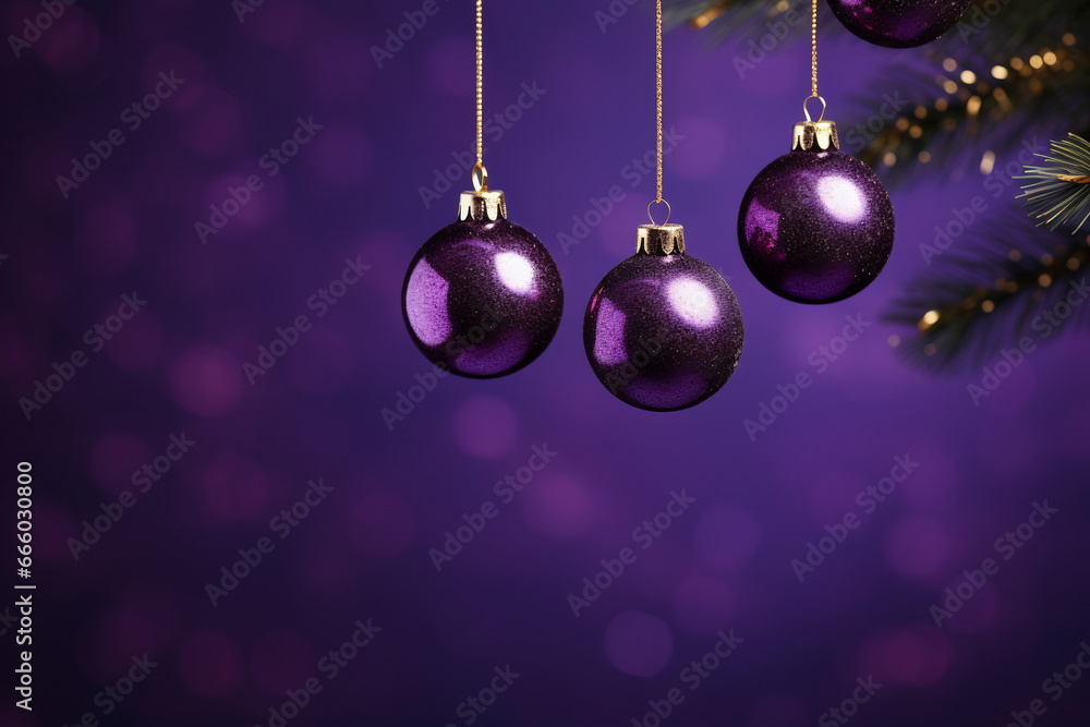 Fototapeta premium Set of Christmas toys hanging on dark purple background