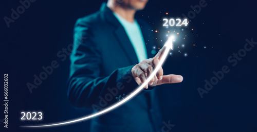 2024 new year, new business start up, target, goal action plan for success growt, market trend 2023-2024, Annual plan development. Businessman draws increase arrow challenge business strategy.