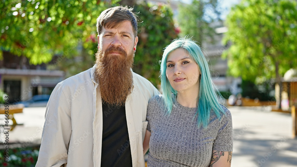 Man and woman couple standing together relaxed at park Man and woman couple standing together relaxed at park