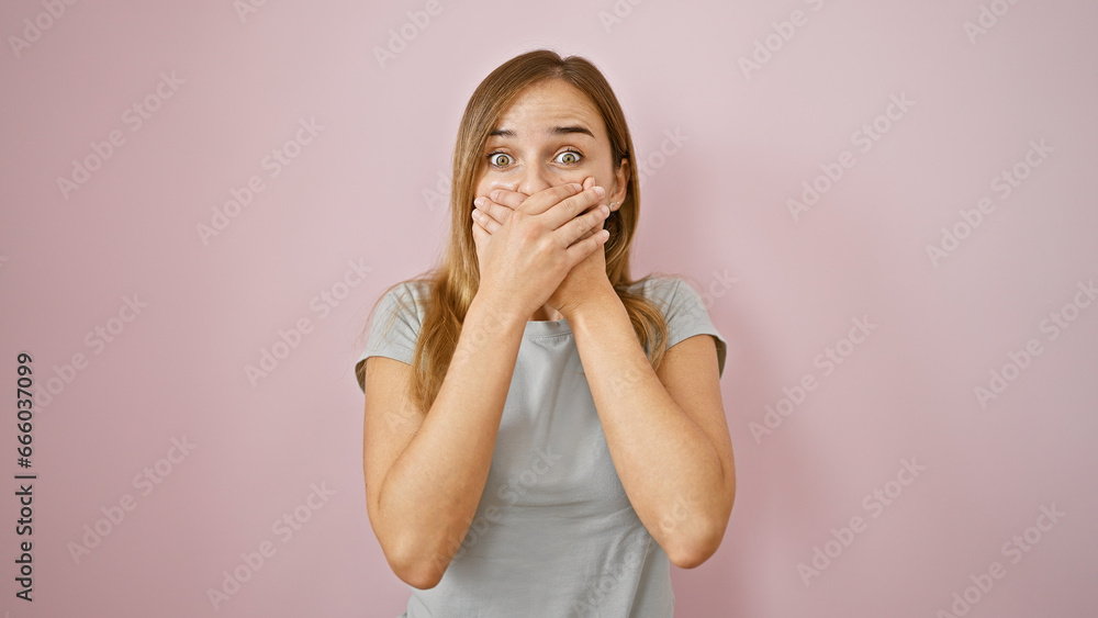 Wow! cheerful young blonde woman, amazed, covering mouth with hands, standing over pink isolated background. beautiful expression of happy surprise! Wow! cheerful young blonde woman, amazed, covering mouth with hands, standing over pink isolated background. beautiful expression of happy surprise!