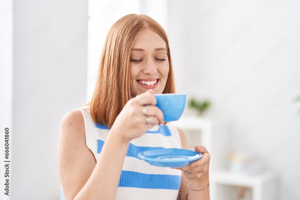 Young redhead woman smiling confident drinking coffee at home Young redhead woman smiling confident drinking coffee at home