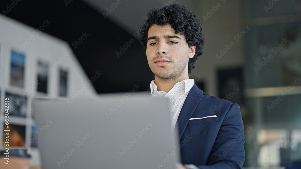 Young latin man business worker using laptop at office Young latin man business worker using laptop at office
