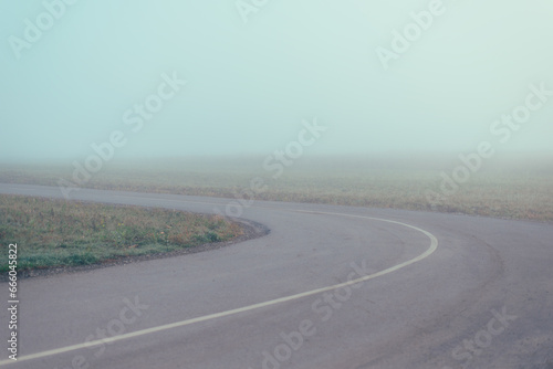 The curve of the road in the fog, pastel colors