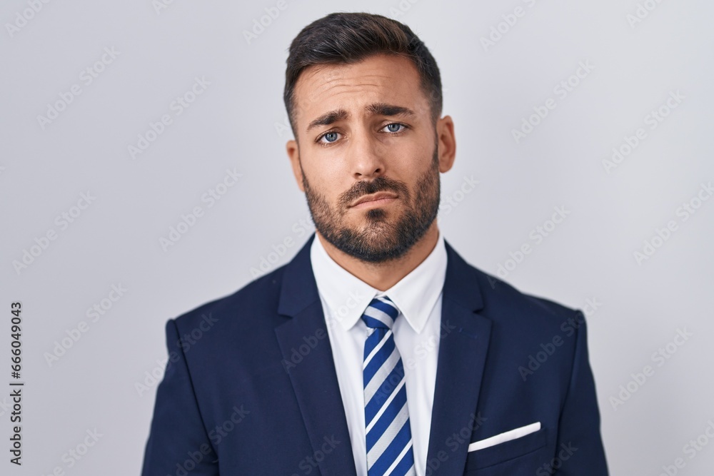 Handsome hispanic man wearing suit and tie looking sleepy and tired, exhausted for fatigue and hangover, lazy eyes in the morning. Handsome hispanic man wearing suit and tie looking sleepy and tired, exhausted for fatigue and hangover, lazy eyes in the morning.