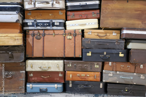 Stack of colorful vintage suitcases. Retro decorative suitcases  new vacation plans and journeys. old style suitcases stacked on top of each other