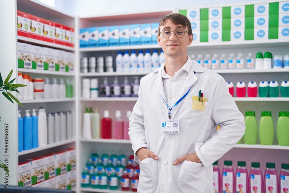 Young caucasian man pharmacist smiling confident standing at pharmacy Young caucasian man pharmacist smiling confident standing at pharmacy