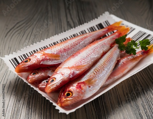 Red mullet fish in plastic market packacge with barcode
