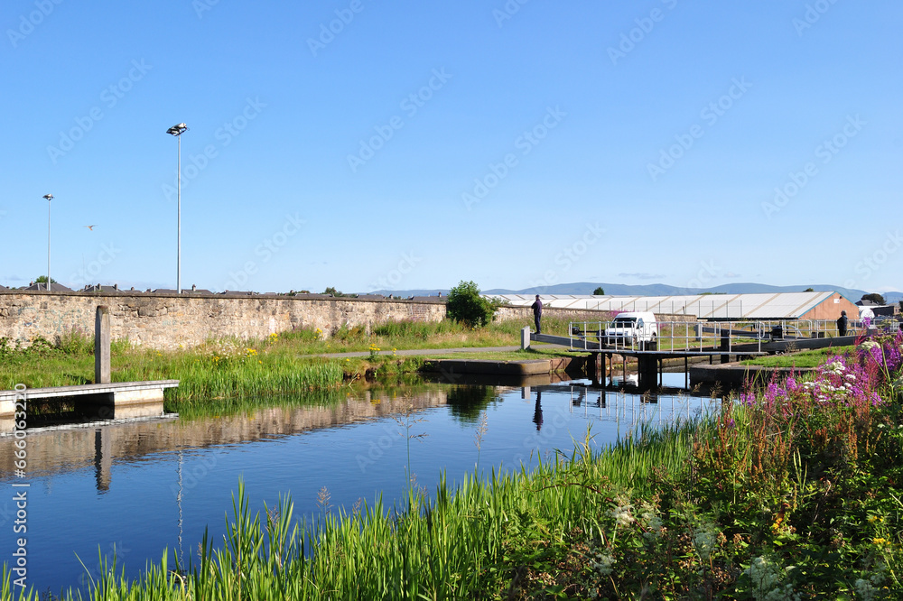Lock and still Waters of Industrial Canal on Sunny Day Lock and still Waters of Industrial Canal on Sunny Day