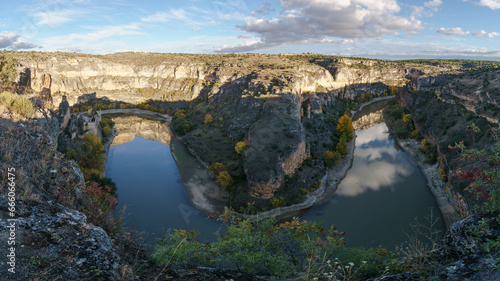 Panorama of River Duraton with old ruin of convent during autumn time in Hoces del Duraton natural park near Sepulveda, Segovia, Spain