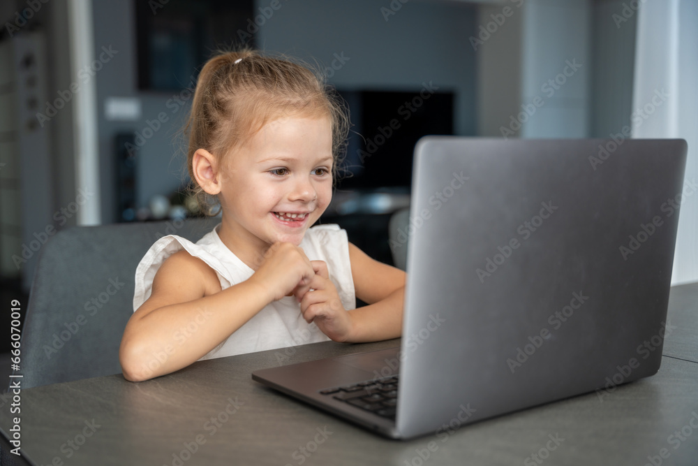 Little girl student online learning, class study online video call with teacher on the laptop home. Distance learning concept. Little girl student online learning, class study online video call with teacher on the laptop home. Distance learning concept.