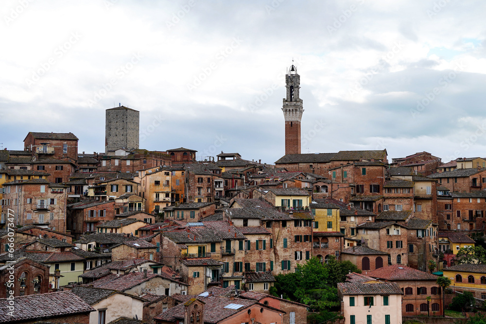 Siena skyline on a cloudy day. Rooftop view of medieval city of Siena. Tuscany, Italy