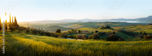 Panorama of landscape with sunrise in Tuscany, Italy photo