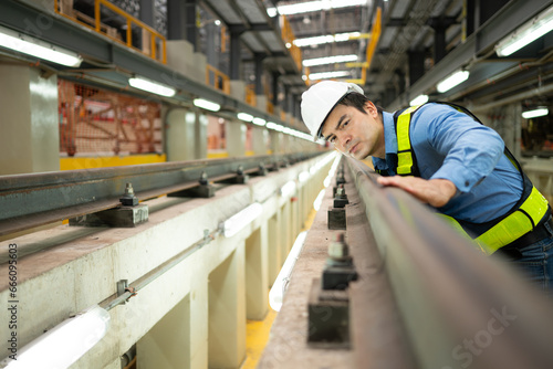 After the electric train is parked in the electric train repair shop, an electric train technician with tools inspect the railway and electric trains in accordance with the inspection round