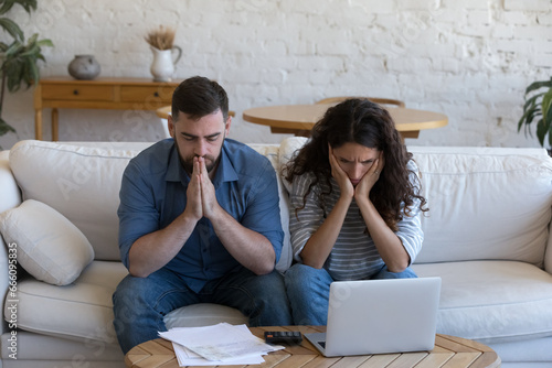 Upset concerned couple of homeowners, renters, bank customers overwhelmed with bad news, having finance loss, money troubles, getting too high mortgage, loan monthly fees