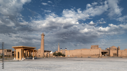 Cityscape with Polvon darvoza gates to Ichan-Kala old city and ancient mosque, Khiva, Uzbekistan photo
