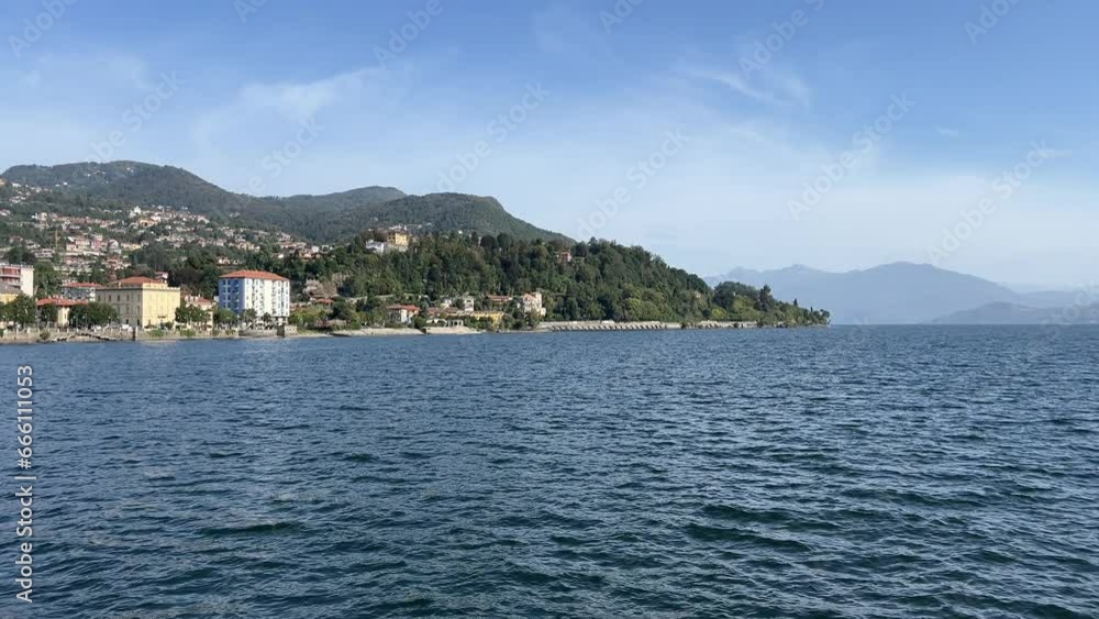 Tranquil Journey on the boat on Lago Maggiore between Verbania to Laveno Mombello at the Switzerland-Italy border. The viewer is treated to breathtaking vistas of the region of lake Maggiore Tranquil Journey on the boat on Lago Maggiore between Verbania to Laveno Mombello at the Switzerland-Italy border. The viewer is treated to breathtaking vistas of the region of lake Maggiore
