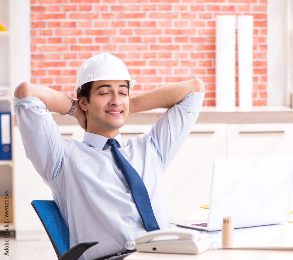 Construction supervisor working on blueprints