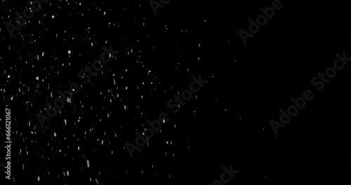 Snowfall on a black background, snowflakes falling at night illuminated by white light with copy space, 3d rendering