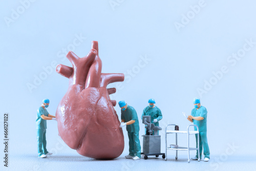 Miniature People Doctor checking and analysis heart model , Science and medicine concept