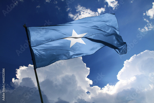 national flag of Somalia waving in the wind on a clear day.