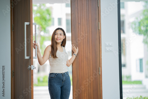 Adult Asian woman open new house's door looking around with smile of happiness. Excited Family Moving In New Home Free Download Adult Asian woman open new house's door looking around with smile of happiness. Excited Family Moving In New Home - GFXLoad