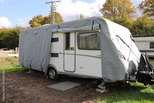 Obraz na plátně a caravan with a gray tarpaulin