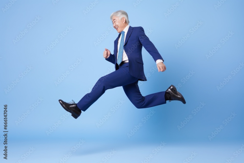 Asian businessman dancing excited happy